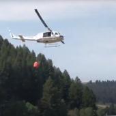 Helicopter approaching to fill bucket